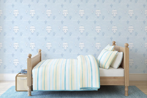 Blue background with white hot air balloon pattern printed on peel and stick wallpaper in Canada