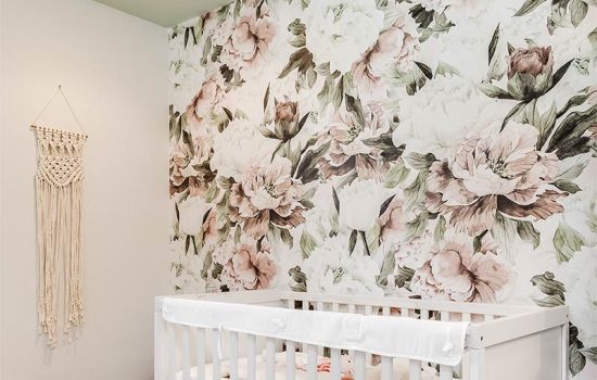Peel and stick wallpaper with floral pattern on wall in child's bedroom