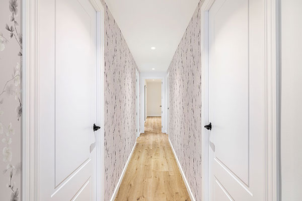 Hallway walls with decorative rose pattern on peel and stick wallpaper